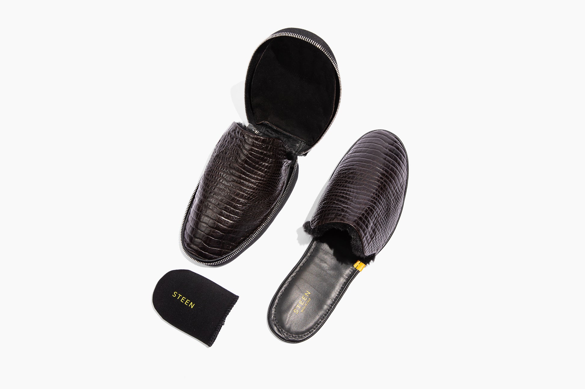 Luxury crocodile embossed leather. Black Eco-fur lining. Foldable travel slipper. Handmade in Italy.